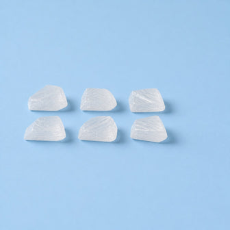 Sodium bicarbonate crystals on a sky-blue studio ground