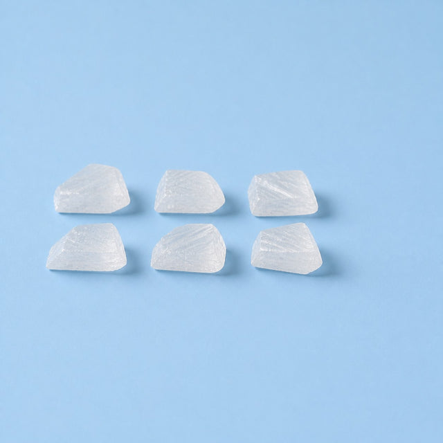 Sodium bicarbonate crystals on a sky-blue studio ground