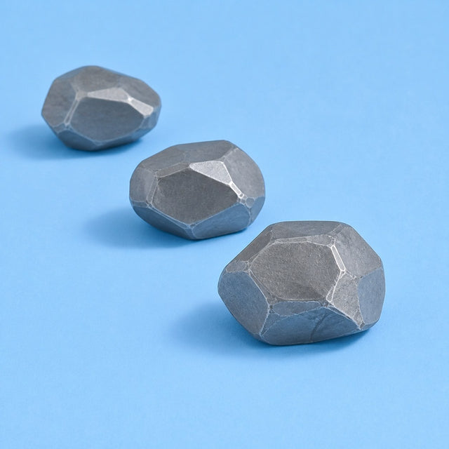 Grey mineral stones on a sky ground